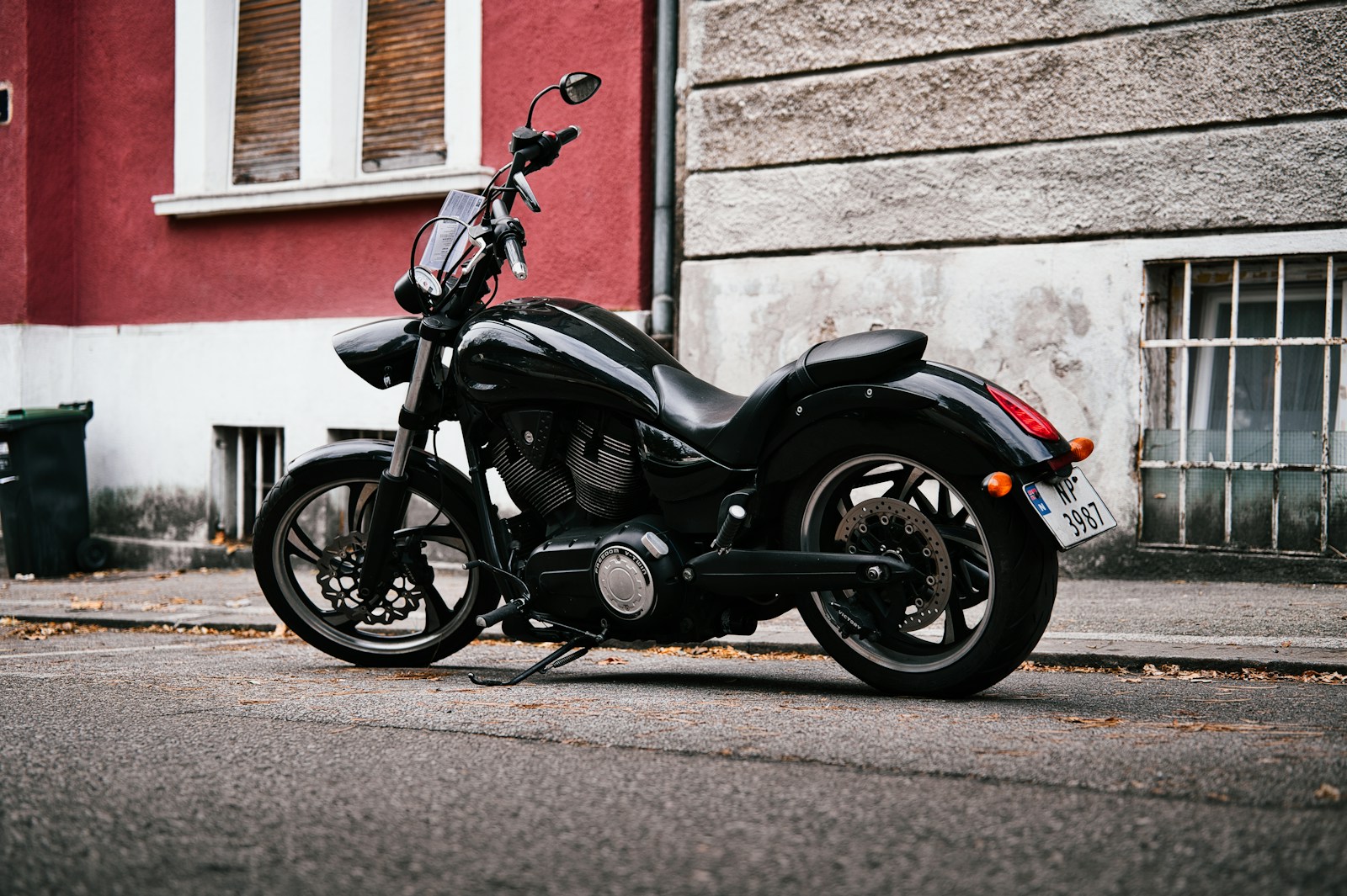 A black motorcycle parked on a street.